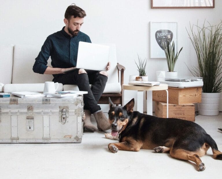 man working from home with dog