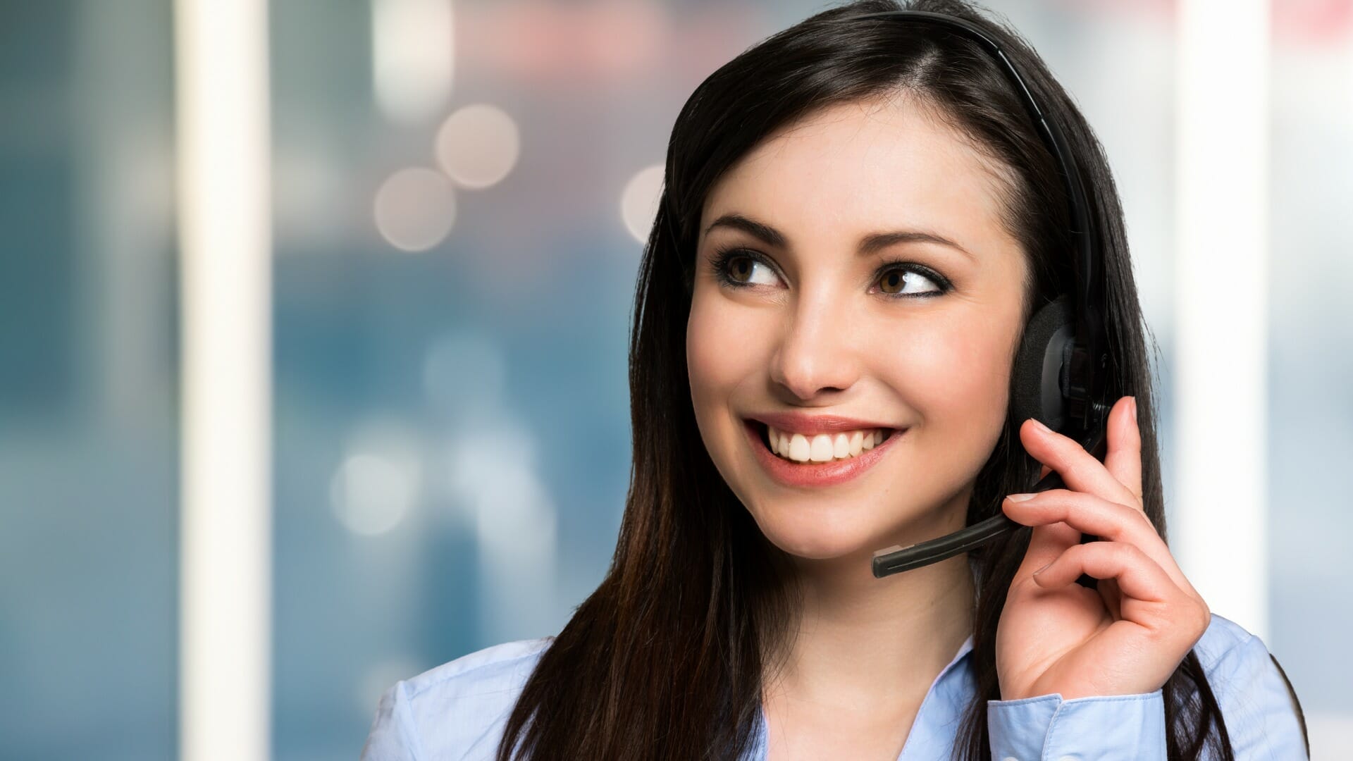 woman smiling with headset - No Longer Tied to a Desk - Carolina Digital Phone - LDR & Co.